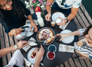 Group of people eating pie